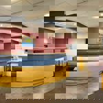 Reception area with front desk, seating, and welcoming décor.