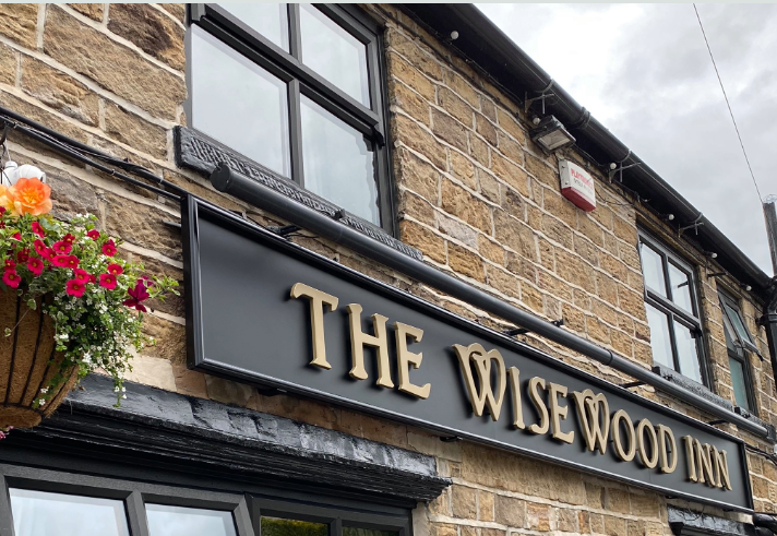 The sign above the door at The Wisewood Inn.