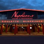 The exterior of Napoleons Casino & Restaurant at night.