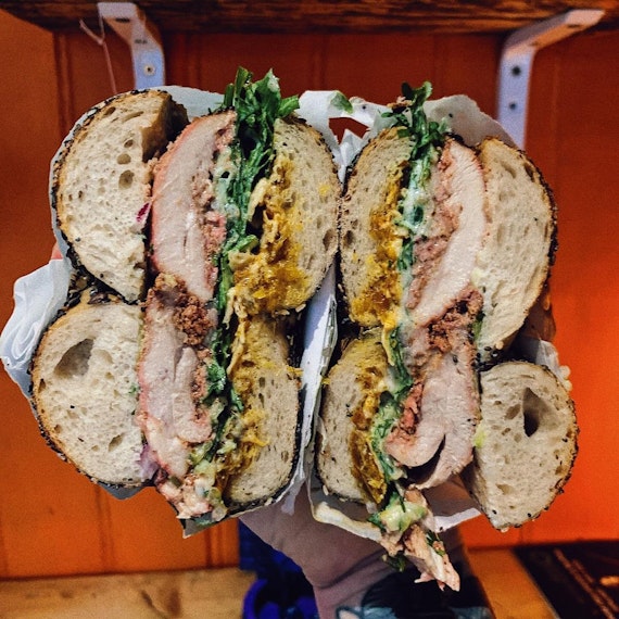 A packed bagel, cut in half so you can see all the fillings, from Best Boy Bagels.