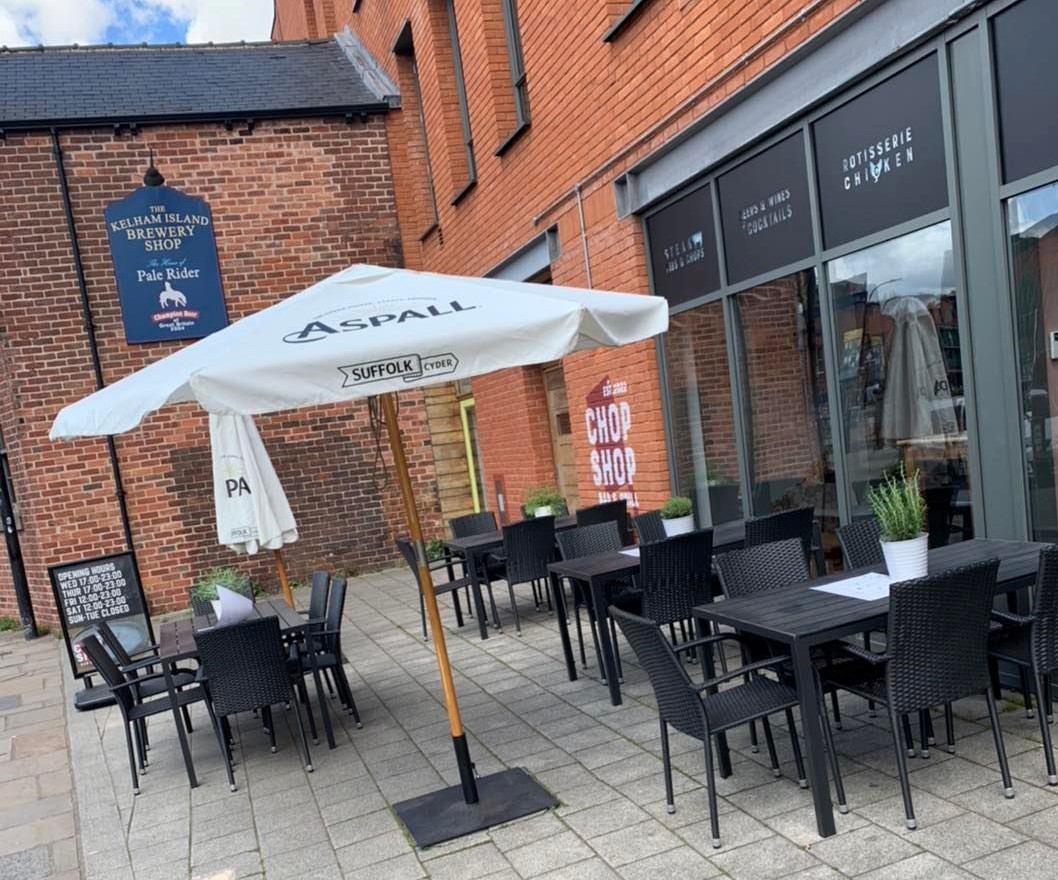 Outdoor tables at the Chop Shop Bar & Grill.