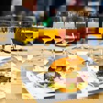 A burger and a row of beers.