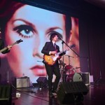 A band playing on a stage.