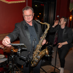 A big band performing in a bar.