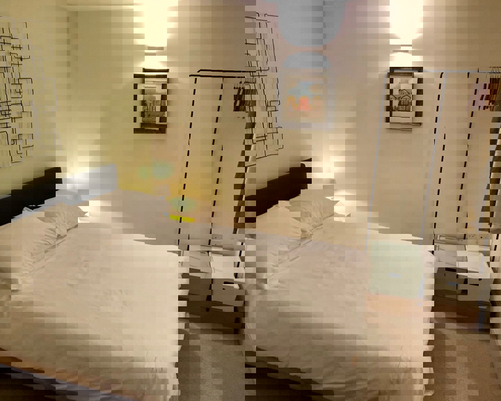 Bright and tidy small double bedroom in Homely Apartments – Figtree with modern décor