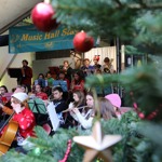 Brass band playing at  Kelham Island Museum with festive decorations 