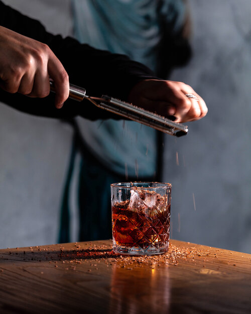 A cocktails being prepared.