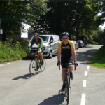 Two people road cycling.