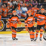 Members of the Sheffield Steelers ice hockey team on the ice at Utilita Arena.