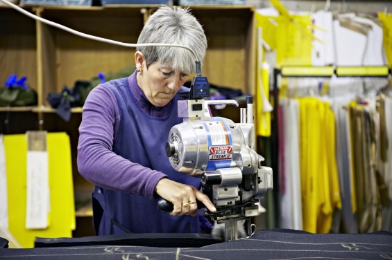 A woman making Buffalo Systems clothing.