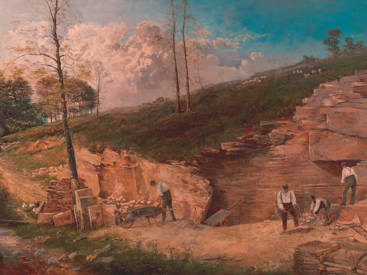A 19th-century painting of a rural quarry scene with four workers breaking and stacking stone slabs. One man uses a wheelbarrow, while others handle tools and rocks. The quarry is cut into a grassy hillside with scattered trees and a stream running along the left. The sky above is bright blue with large, billowing clouds, creating a contrast with the earthy tones of the exposed rock.