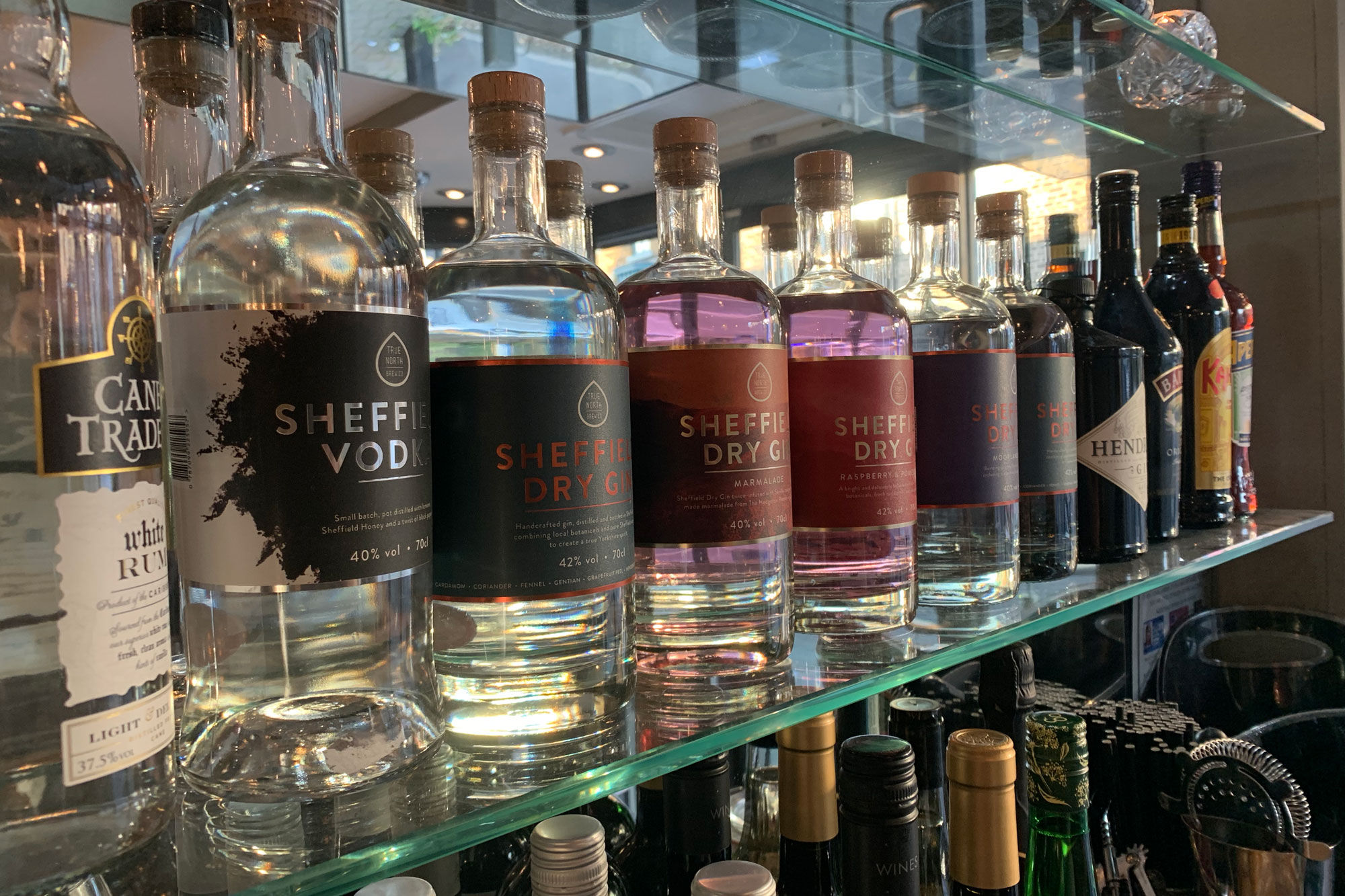 A shelf full of bottles of spirits at Turnip & Thyme.