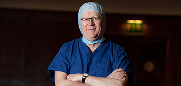 David Stanley wearing surgical scrubs.