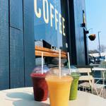 Three smoothies on a table outside Gaard Coffee Hide.