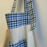 An apron hanging on a wall.