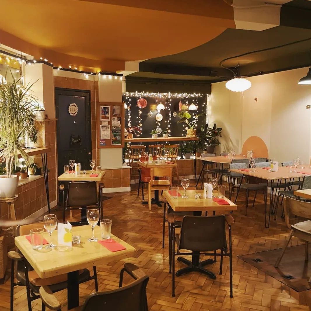 Tables set out at Kopi & Chai.