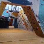 An archway covered in climbing holds at The Climbing Works.