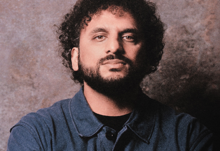 Studio portrait of Nish Kumar.