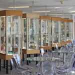 Rows of display cabinets at the Turner Museum Of Glass.
