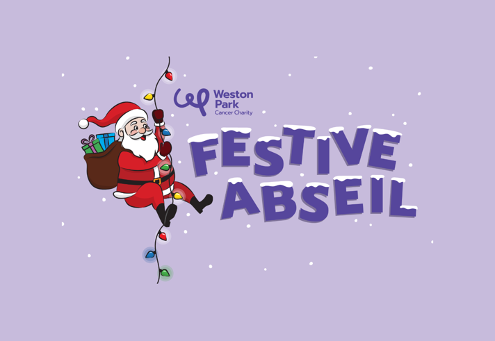 A cartoon illustration of Father Christmas abseiling down a string of fairy lights, next the the words Festive Abseil that have snow settling on top of them.