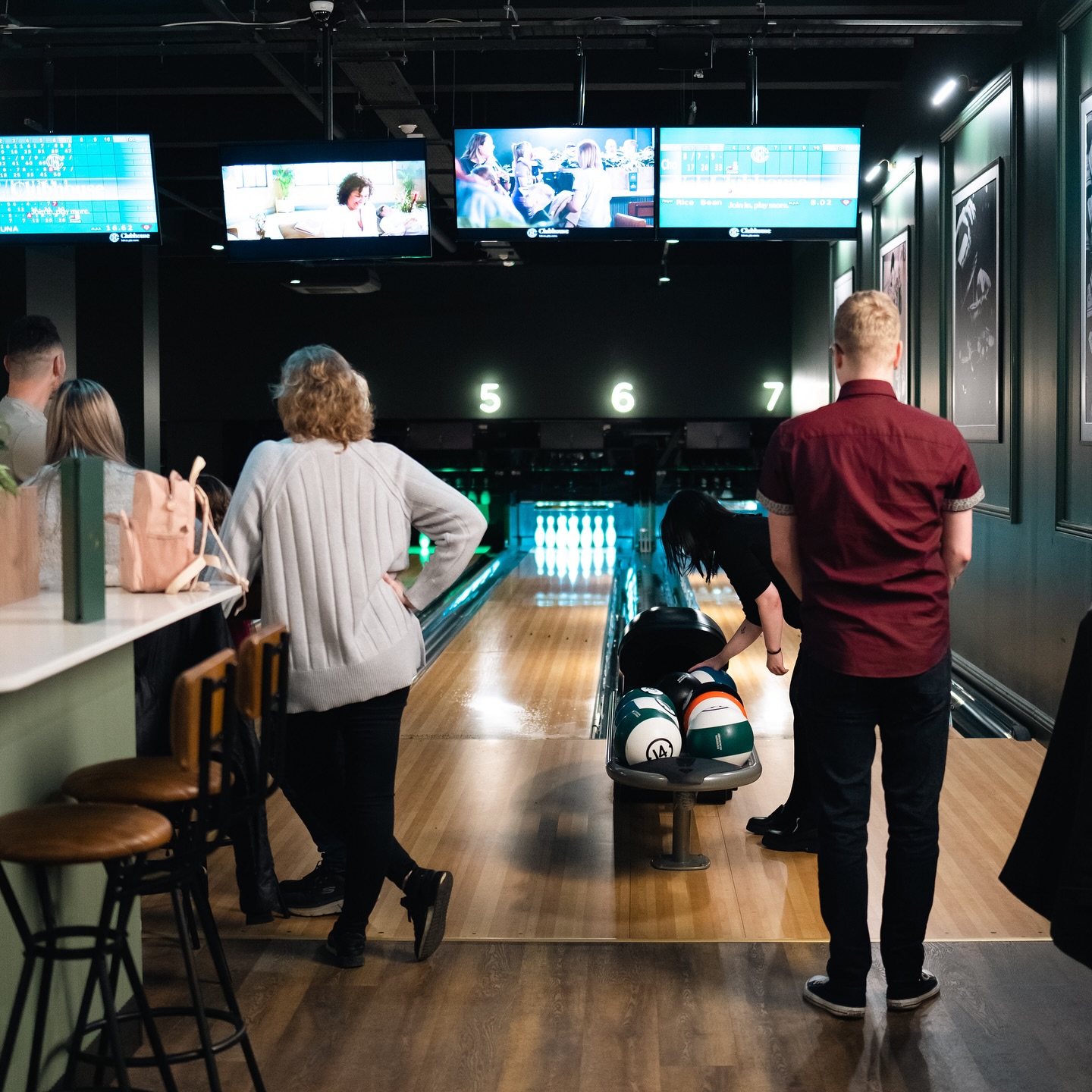 People bowling at Clubhouse.