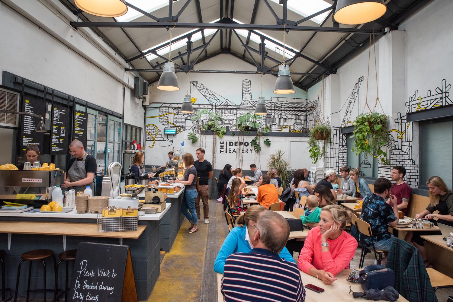 The interior of a busy coffee shop.