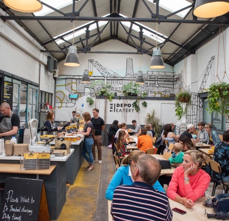 The interior of a busy coffee shop.