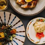A tabletop spread of vibrant dishes.