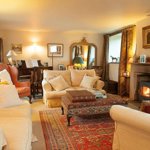 Loadbrook Cottage – living room with soft furnishings and a log burner.