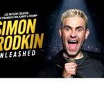 Promotional tour poster featuring a person holding a microphone under a spotlight against a dark stage background. Large yellow and white text reads: “Simon Brodkin Unleashed.” Smaller text above states: “Lee Nelson creator who pranked FIFA, Kanye & Trump.” Additional text on the right reads: “Stand-Up Tour 2026/27.” The design uses bold typography and a high-contrast black and gold colour scheme.