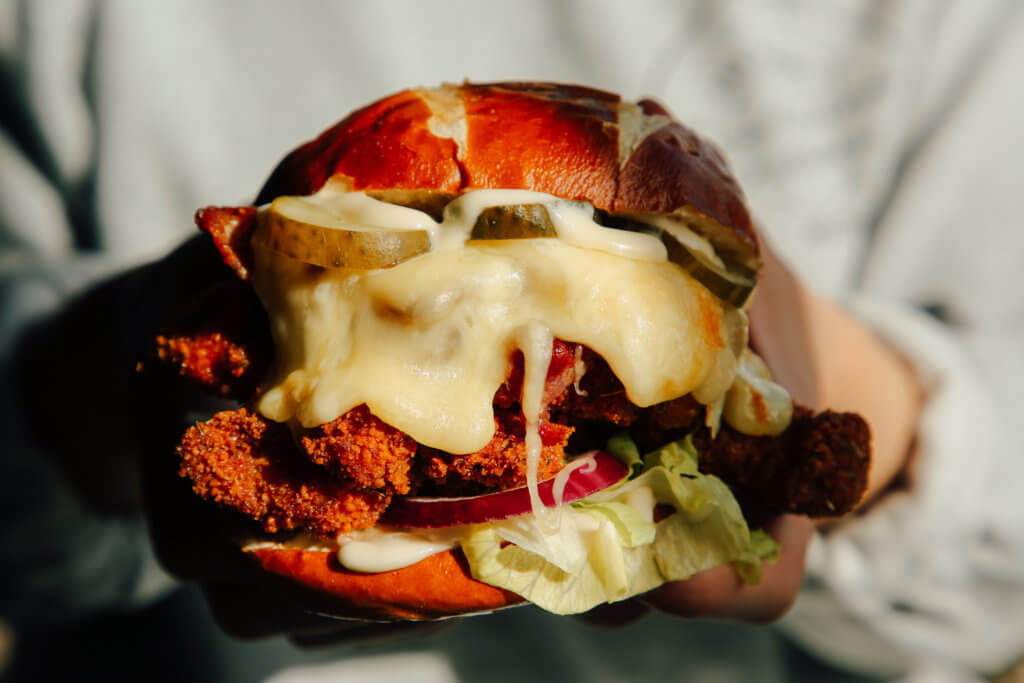 A cheese burger being carried by a member of staff at the Two Thirds Beer Co.