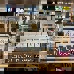 A shelf stacked with goods for sale.