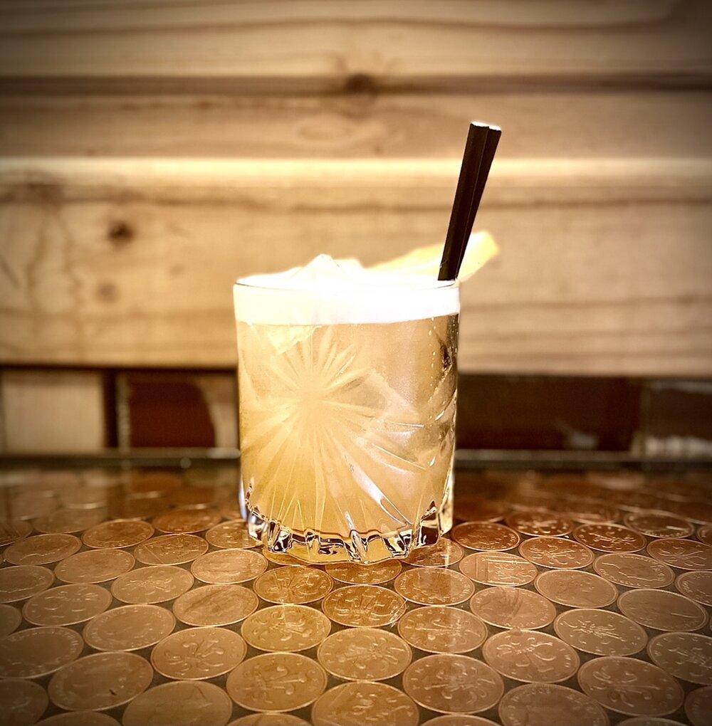 A cocktails sat on a table.