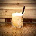 A cocktails sat on a table.