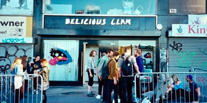 People waiting outside Delicious Clam before a gig.
