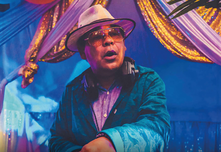 Craig Charles looking dapper in a hat and shades.