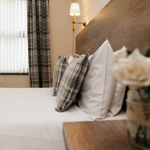 A double bed in a hotel room.