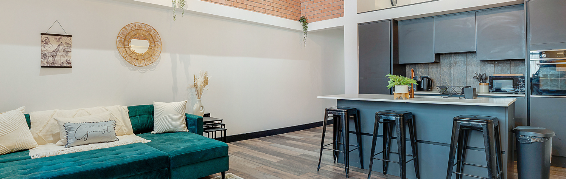 Modern living room with a kitchenette in the same open-plan space.