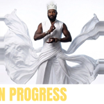 A promo image featuring a man in flowing white robes.