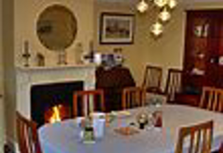 Elegant table set for guests at Wortley Cottage Guest House with fresh linens and tableware.
