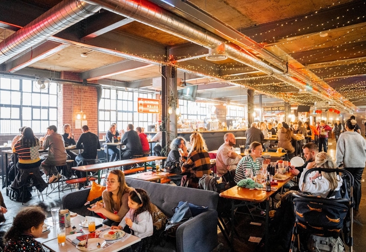 Inside Cutlery Works, filled with customers dining.