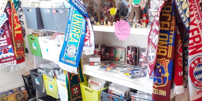 Shelves packed full of things for sale at The Indie Arcade.