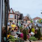 A group of happy people sat drinking outside The Gin Bar on Abbeydale Road 
