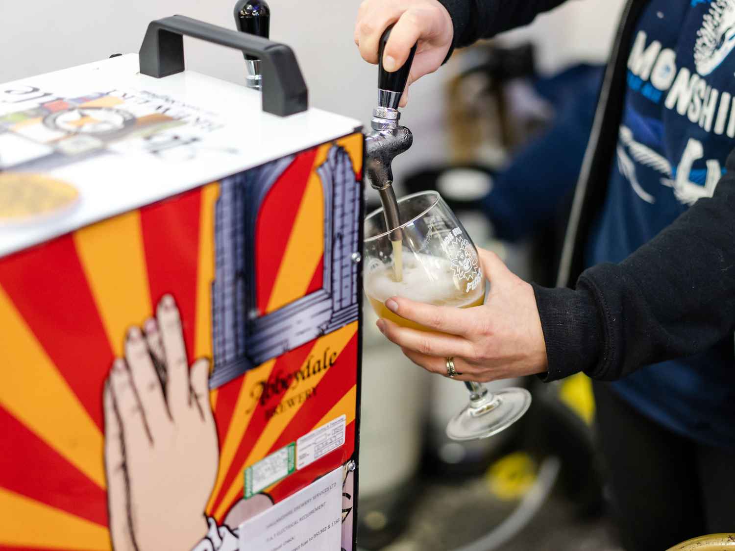 Someone pouring a pint from Abbeydale Brewery tap