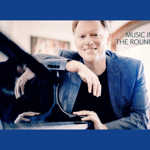 Tim Horton sat at a grand piano.