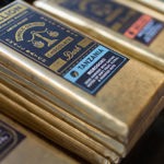 A close-up of bars of Bullion chocolate stacked up on a display.
