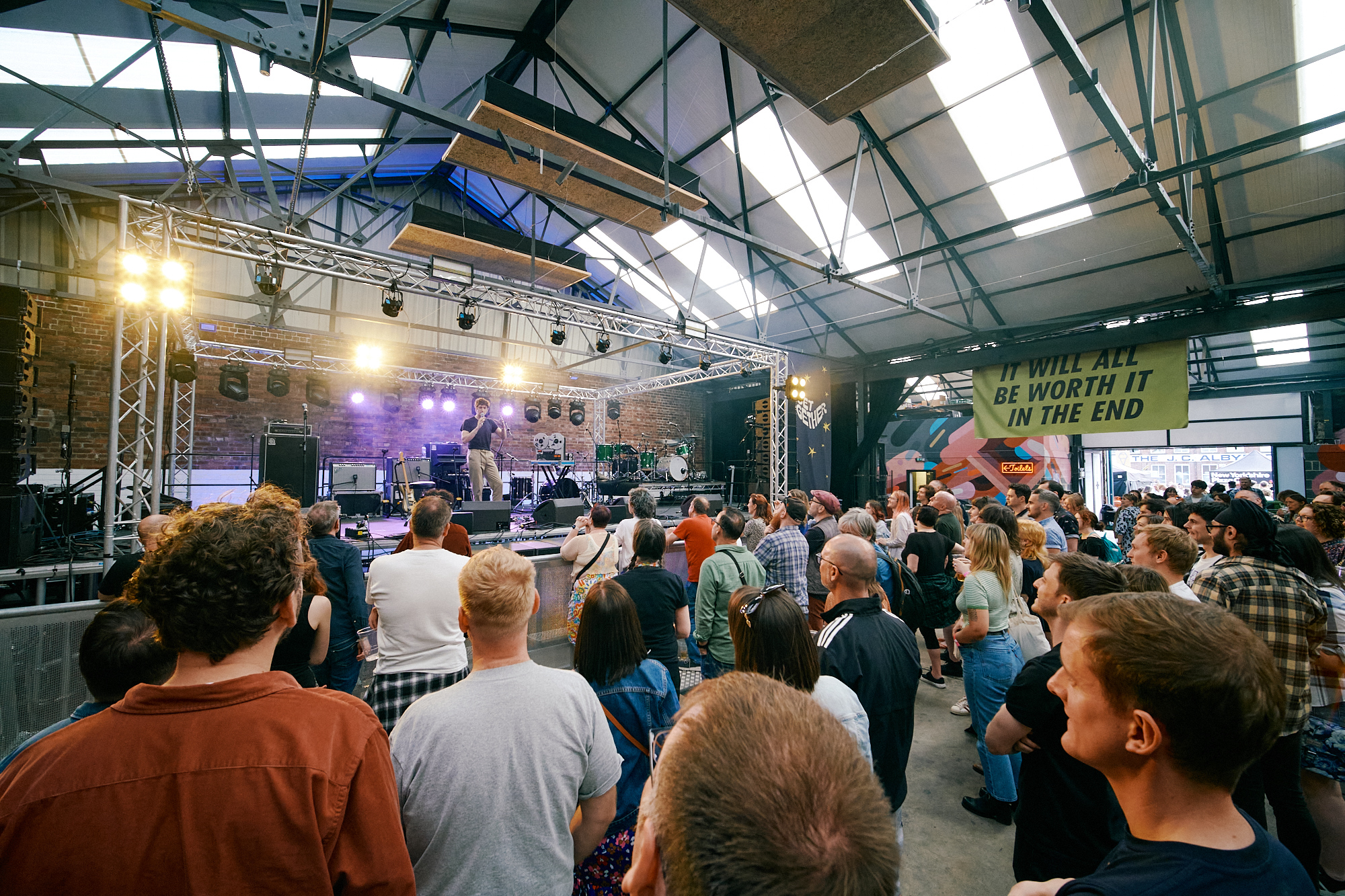 View of live music stage at Peddler Warehouse for Get Together 2023