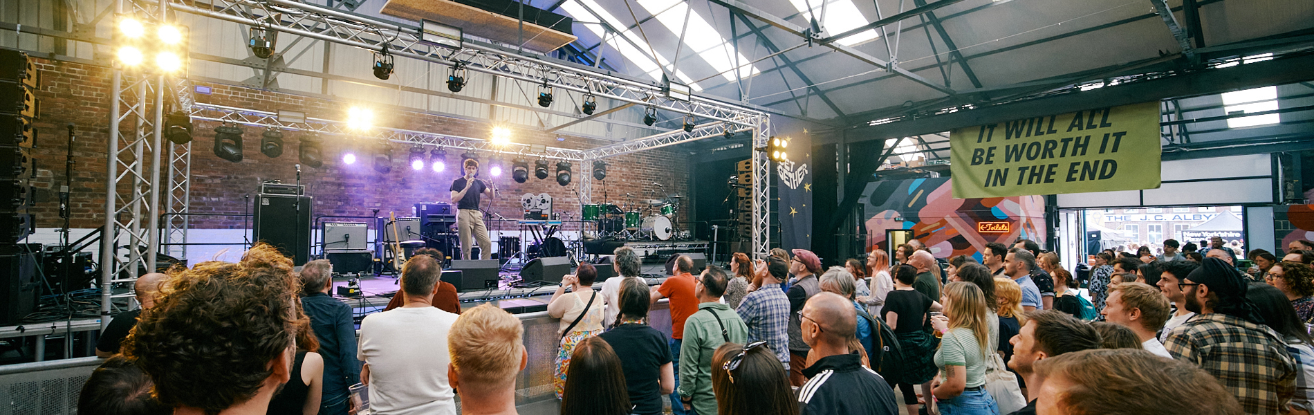 View of live music stage at Peddler Warehouse for Get Together 2023