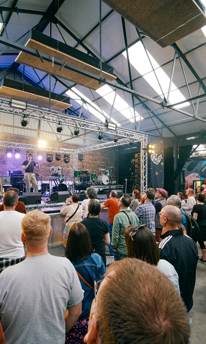 View of live music stage at Peddler Warehouse for Get Together 2023