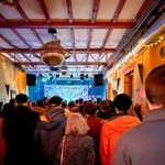 A crowd watches a band performing at Yellow Arch.